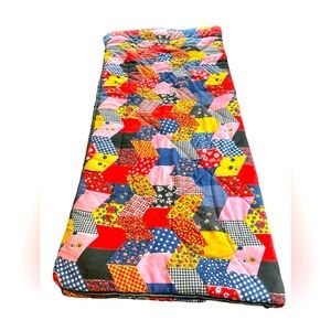 Vintage Coleman sleeping bag with patchwork type groovy design, metal zipper